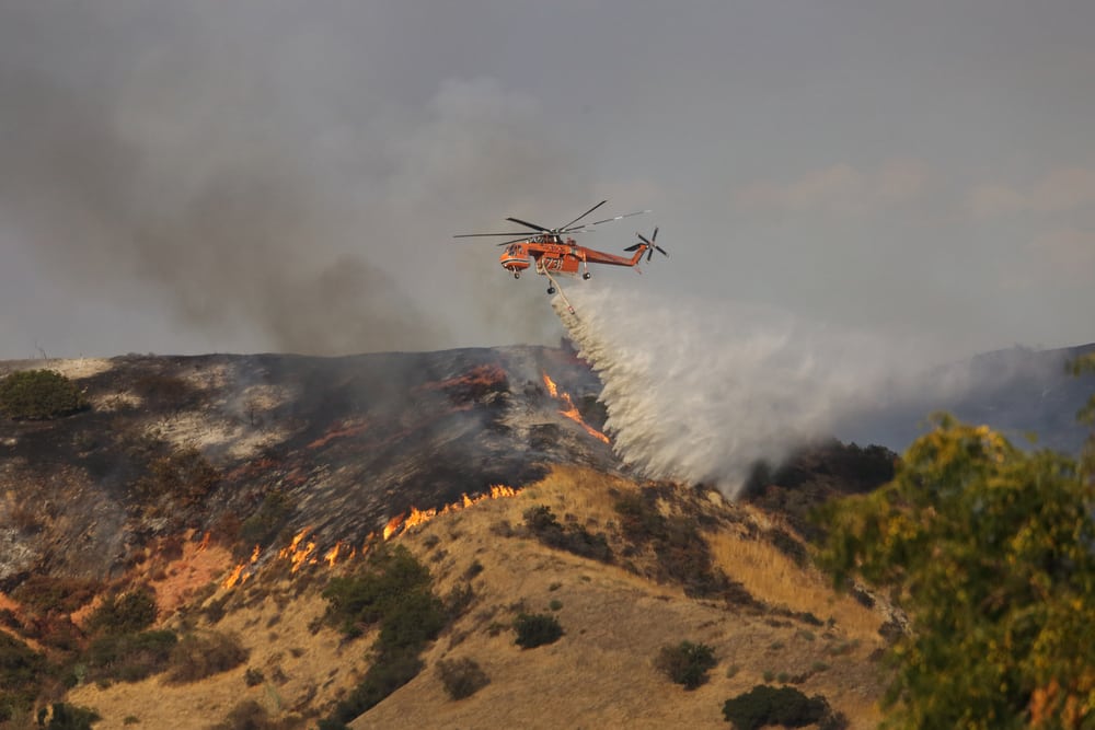 Helicopter drops fire retardant on La Tuna fire in Los Angeles in 2017