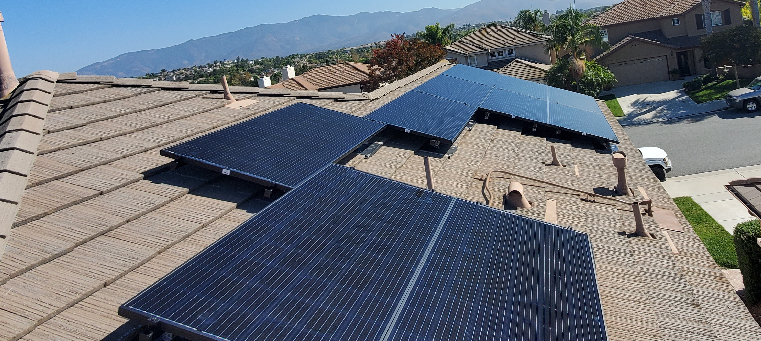 Ten solar panels on two story home mountains.